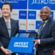 Tanzanian and JETRO officials exchange an Invest Tanzania gift set during Tanzania's investment promotion campaign in Japan